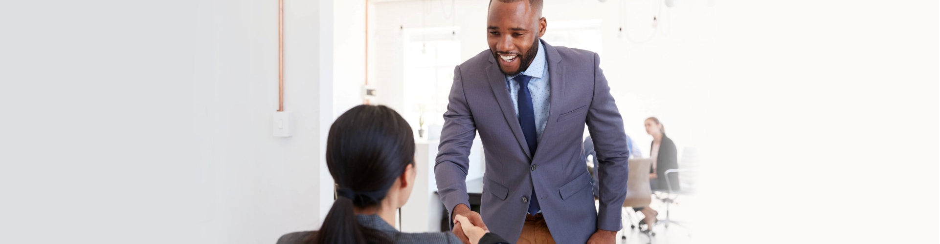 man and woman shaking hands